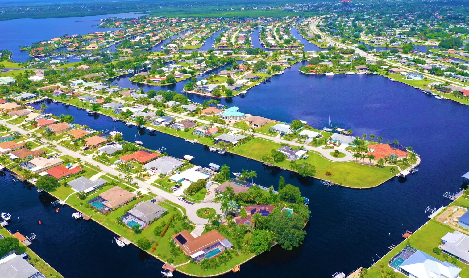 Port Charlotte canal homes aerial view showing waterfront properties and boat docks